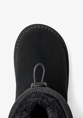 Black Australian-style lace-up boots