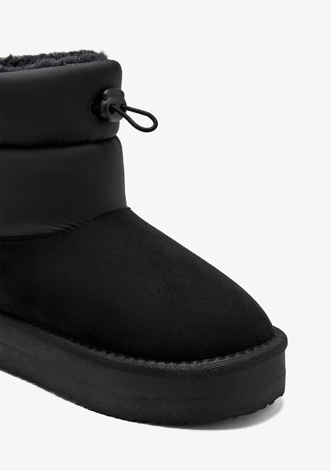 Black Australian-style lace-up boots
