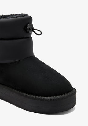 Black Australian-style lace-up boots
